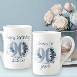 90th Birthday Cheers to 90 Years Floral Number Bone China Mug<br><div class="desc">90th birthday mug, with fully editable wording to personalize as you wish, such as "happy birthday [name]" and/or "cheers to 90 years". Design features number 90 decorated with rose buds, flower blooms and foliage in shades of coastal blue and sand. Subtle feminine and elegant design with watercolor floral arrangements, paint...</div>