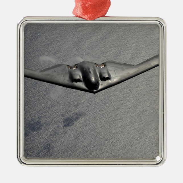 A B-2 Spirit flies over the Pacific Ocean Metal Ornament (Front)