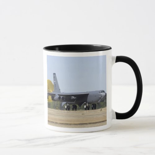 A B_52 Stratofortress deploys its drag chute Mug