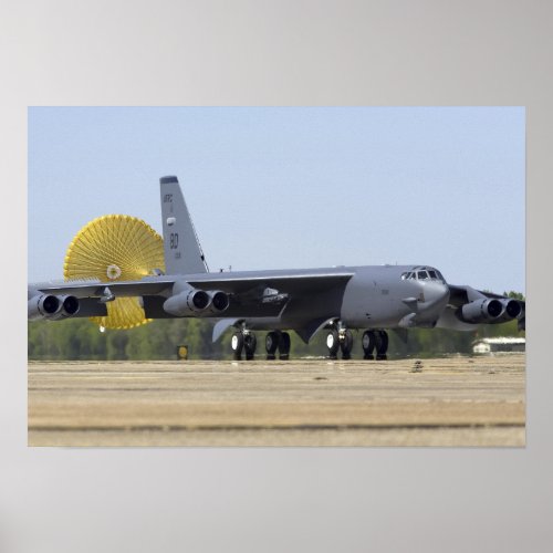 A B_52 Stratofortress deploys its drag chute Poster