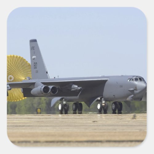 A B_52 Stratofortress deploys its drag chute Square Sticker