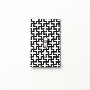 A b&w patterns made with 'plus' sign light switch cover