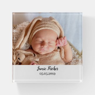 A baby photo paperweight