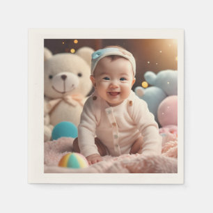 A baby smiling napkins