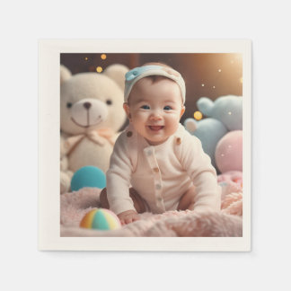 A baby smiling napkins