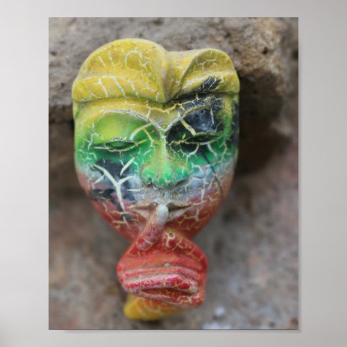 A Bali face mask with finger on its mouth Poster