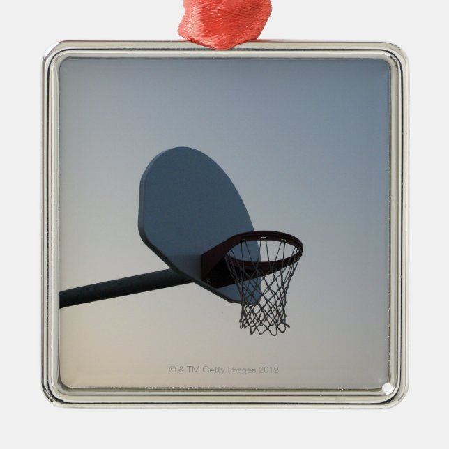 A basketball backboard hoop and net. Clear blue Metal Ornament (Front)