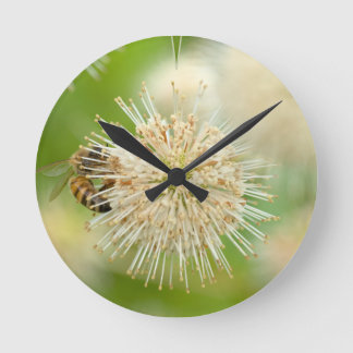 A Bee on a Flower Round Clock