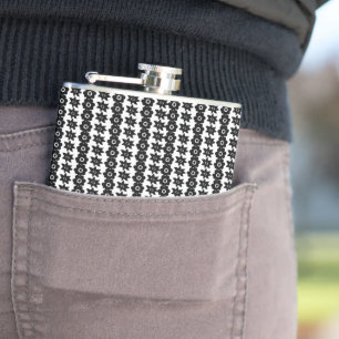 a black and white background with a lot of dots flask