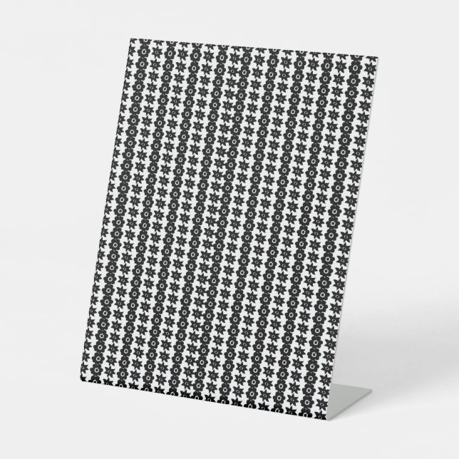 a black and white background with a lot of dots pedestal sign (Front)
