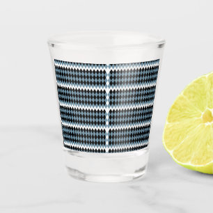 a black and white checkered pattern with a white b shot glass