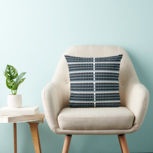 a black and white checkered pattern with a white b throw pillow