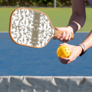 a black and white photo of a pattern carbon fiber pickleball paddle