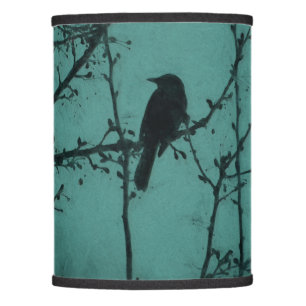 A Black Bird on a Branch with a Teal Background Lamp Shade