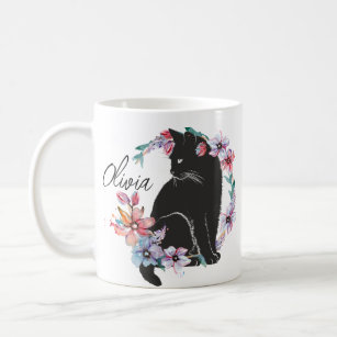 A black cat surrounded by flowers  coffee mug