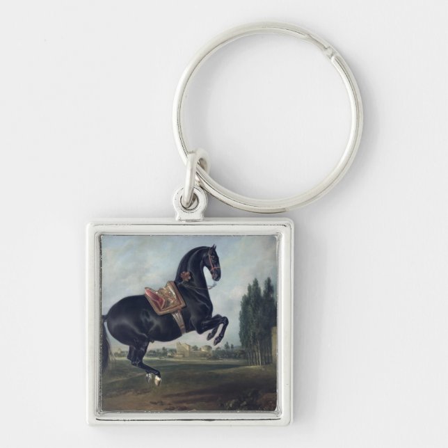 A black horse performing the Courbette Keychain (Front)