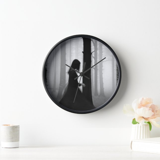 A black shadow brushes past the tree clock (Home)