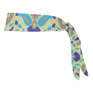 a blue and green pattern on a green background tie headband