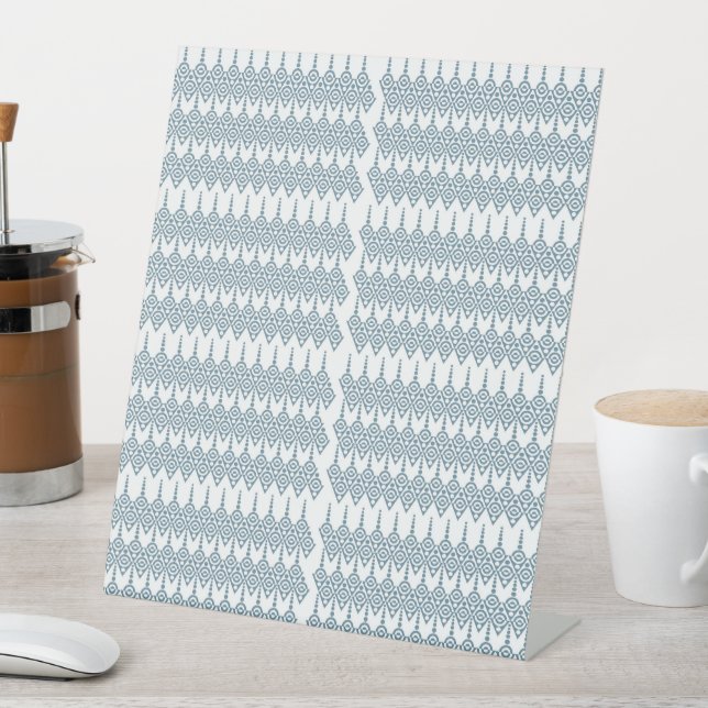 a blue and white pattern with a white background pedestal sign (In SItu)