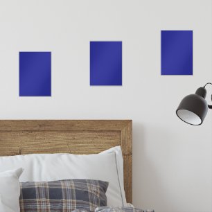 A blue background featuring a prominent white squa wall art sets