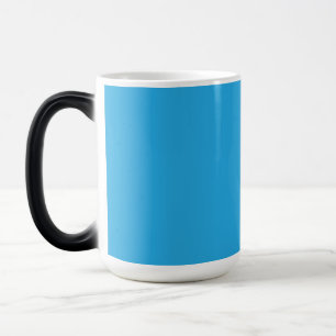 a blue background with a black and white cat color morph mug