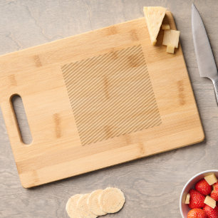 a blue background with a black and white cat engraved cutting board