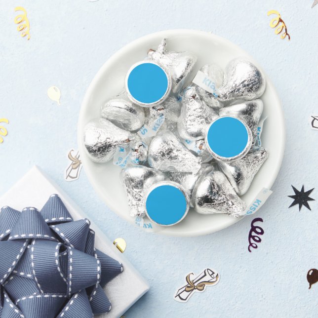 a blue background with a black and white cat on to hershey®'s kisses® (Party)