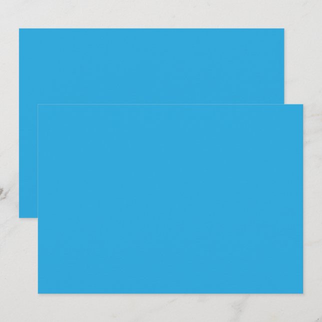 a blue background with a black and white cat on to invitation (Front/Back)