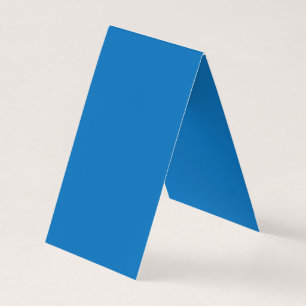a blue background with a black and white clock business card