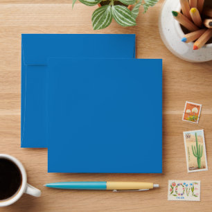 a blue background with a black and white clock envelope