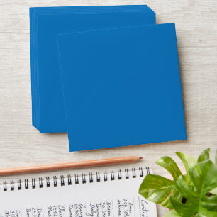 a blue background with a black and white clock envelope