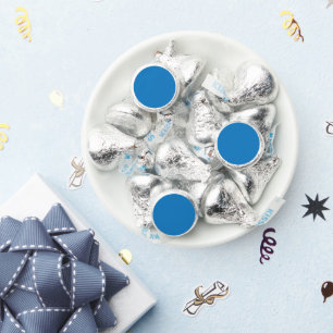a blue background with a black and white clock hershey®'s kisses®