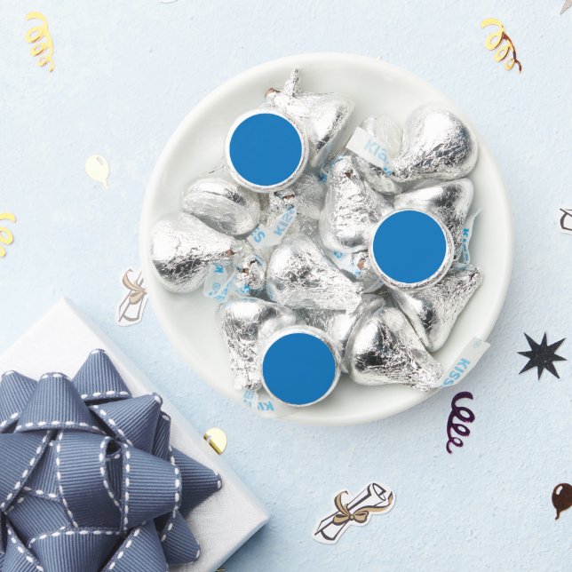 a blue background with a black and white clock hershey®'s kisses® (Party)