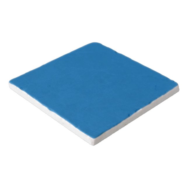 a blue background with a black and white clock trivet (Corner)