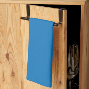 a blue background with a kitchen towel