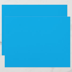a blue sky with a plane flying in the sky letterhead