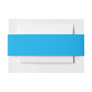 a blue sky with a plane invitation belly band