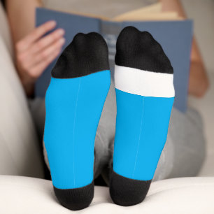 a blue sky with a plane  socks