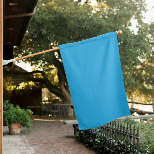 A blue square framed by a white border, presenting house flag