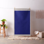 a blue wall with a clock on it fabric