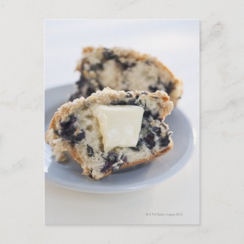 A blueberry muffin with butter postcard