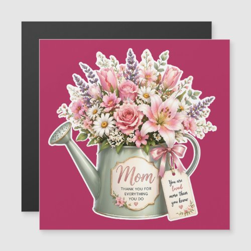 A bouquet of flowers in a watering can for mom