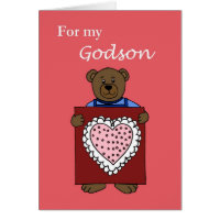 A boy bear holding a valentine card