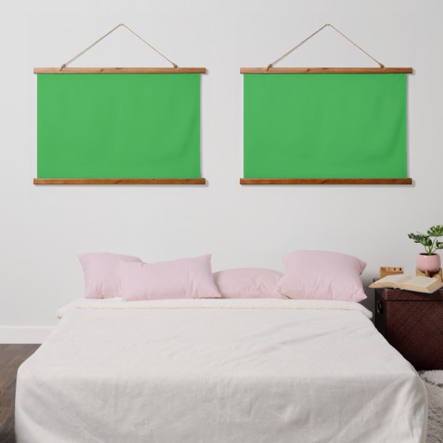A bright green screen set against a clean white ba hanging tapestry (Bedroom)