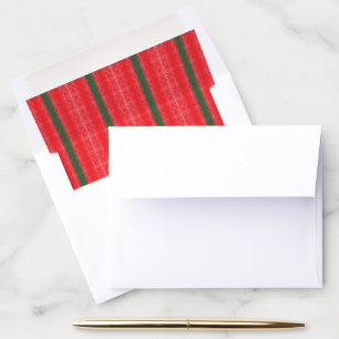 A bright red apple sits on a plain white surface. envelope liner