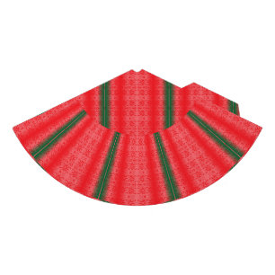A bright red apple sits on a plain white surface. party hat