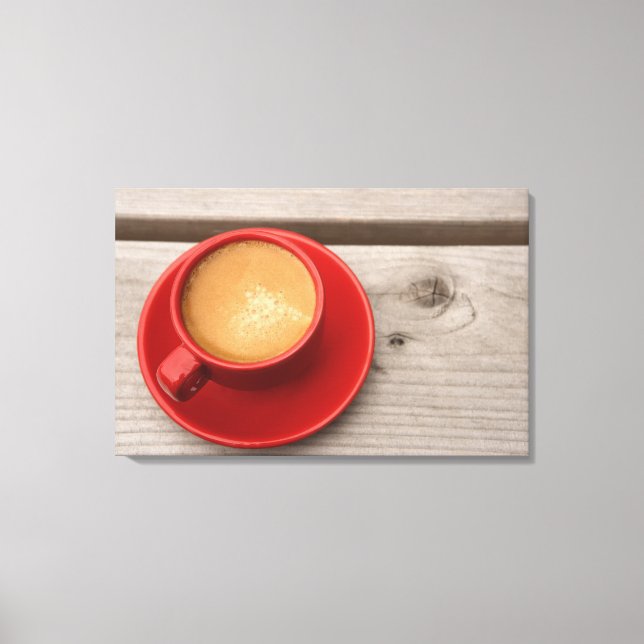 A bright red cup of espresso coffee on a picnic canvas print (Front)