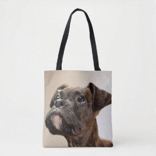A Brindle Boxer puppy looking up curiously. Tote Bag