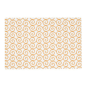 A brown and orange rug with a repeating pattern mo placemat