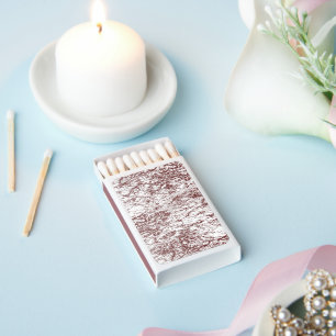 a brown and white background with a rough texture matchboxes